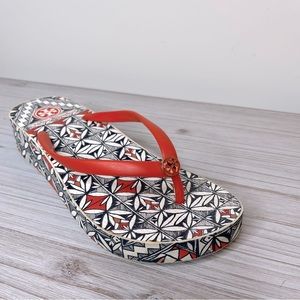 Tory Burch Orange Wedge Flip Flops Size 9, some wear around the top rim.